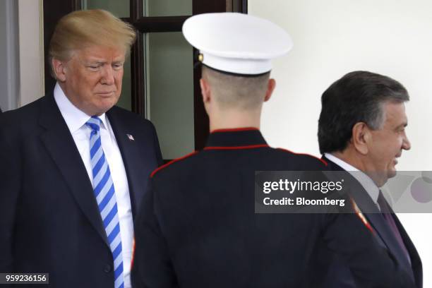 President Donald Trump, left, exits with Shavkat Mirziyoev, Uzbekistan's president, following a meeting at the White House in Washington, D.C., U.S.,...