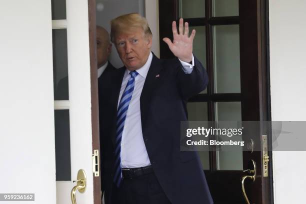 President Donald Trump waves as Shavkat Mirziyoev, Uzbekistan's president, not pictured, leaves after a meeting at the White House in Washington,...