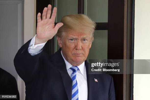 President Donald Trump waves as Shavkat Mirziyoev, Uzbekistan's president, not pictured, leaves after a meeting at the White House in Washington,...