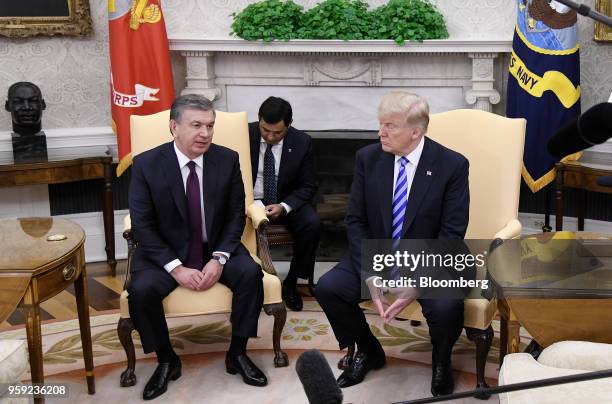 Shavkat Mirziyoev, Uzbekistan's president, left, speaks during as U.S. President Donald Trump listens during a meeting in the Oval Office of the...