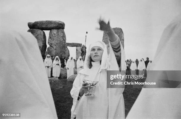 Druids celebrating the summer solstice at Stonehenge, UK, 21st June 1978.