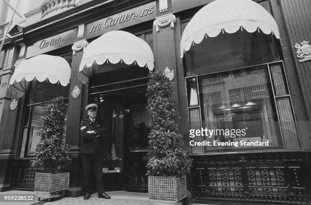Security guard standing outside the Cartier shop on Old Bond Street, London, UK, 29th June 1978.
