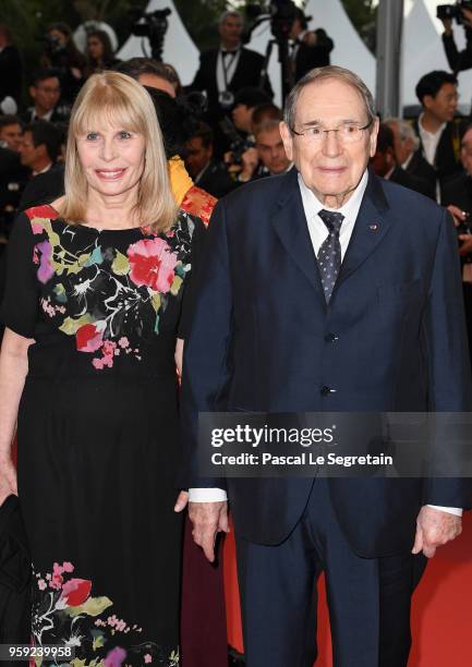 Robert Hossein and wife Candice Patou attend the screening of "Burning" during the 71st annual Cannes Film Festival at Palais des Festivals on May...