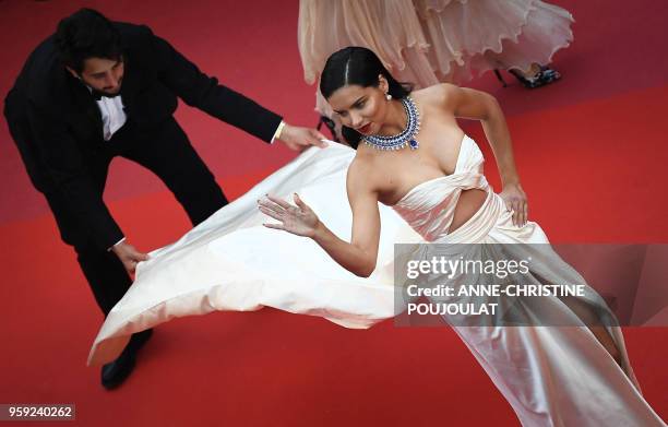 Brazilian model Adriana Lima poses as she arrives on May 16, 2018 for the screening of the film "Burning" at the 71st edition of the Cannes Film...