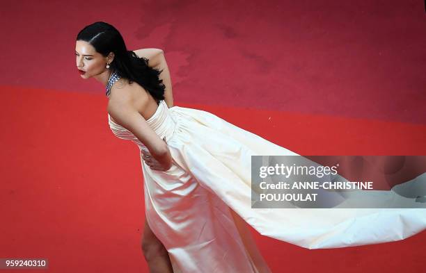 Brazilian model Adriana Lima poses as she arrives on May 16, 2018 for the screening of the film "Burning" at the 71st edition of the Cannes Film...