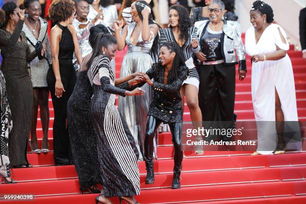 Authors of the book "Noire N'est Pas Mon Métier" dance on the stairs at the screening of "Burning" during the 71st annual Cannes Film Festival at...