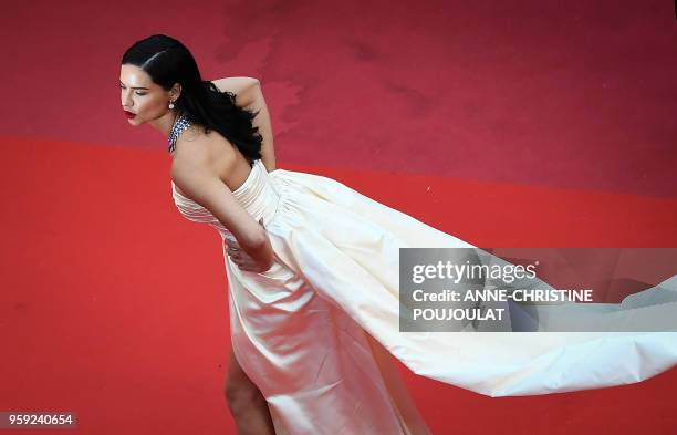 Brazilian model Adriana Lima poses as she arrives on May 16, 2018 for the screening of the film "Burning" at the 71st edition of the Cannes Film...