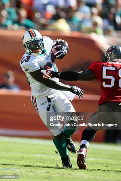 Ronnie Brown of the Miami Dolphins carries the ball during a NFL game against the Tampa Bay Buccaneers at Land Shark Stadium on November 15, 2009 in...