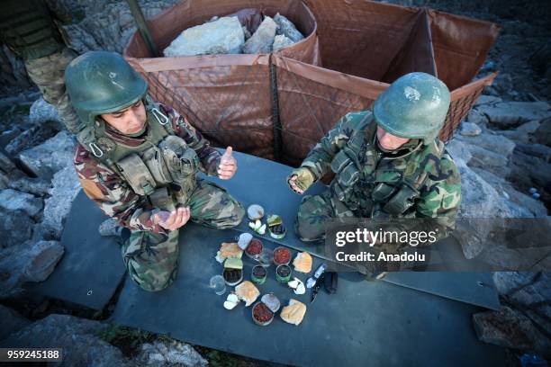 Turkish soldiers pray before breaking their fast on the first day of Holy month of Ramadan at the high-altitude base in Mount Balkaya in Semdinli...