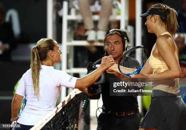 Maria Sharapova of Russia is congratulated by Dominika Cibulkova of Slovakia after her three set win during day four of the Internazionali BNL...