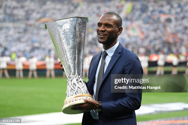 Eric Abidal walks out with the trophy ahead of the UEFA Europa League Final between Olympique de Marseille and Club Atletico de Madrid at Stade de...