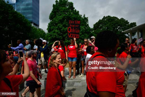 Teachers and supporters hold signs during a 'March For Students And Rally For Respect' protest in Raleigh, North Carolina, U.S., on Wednesday, May...