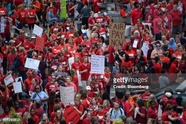 Teachers and supporters hold signs during a 'March For Students And Rally For Respect' protest in Raleigh, North Carolina, U.S., on Wednesday, May...