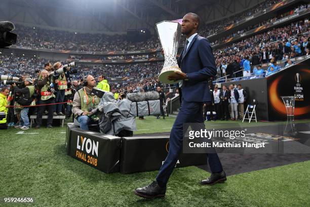 Eric Abidal walks out with the trophy ahead of the UEFA Europa League Final between Olympique de Marseille and Club Atletico de Madrid at Stade de...