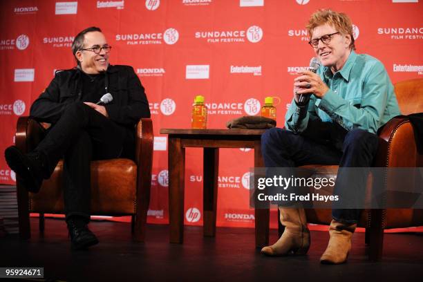 Director of the Sundance Film Festival John Cooper and Sundance Institute President and Founder Robert Redford speak onstage during the Opening Day...