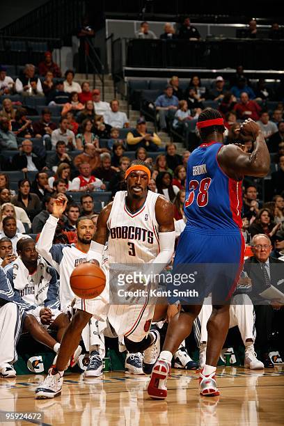 Gerald Wallace of the Charlotte Bobcats moves the ball against Kwame Brown of the Detroit Pistons during the game on December 22, 2009 at the Time...