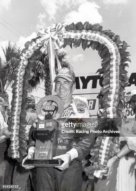 Bobby Allison celebrates in victory lane after the Pepsi Firecracker 400. Allison would take home $57,375 for the race.