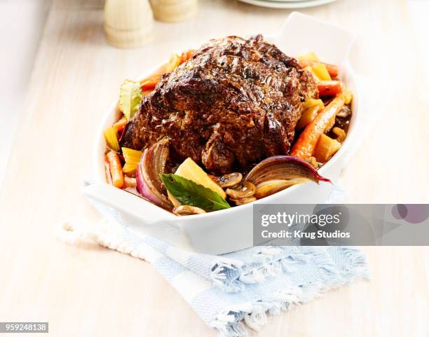 beef pot roast with roasted potatoes and vegetables - schmorbraten stock-fotos und bilder