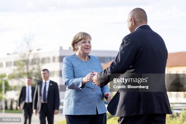 Angela Merkel, Germany's chancellor, is greeted by Boyko Borissov, Bulgaria's prime minister, right, as she arrives for an informal dinner in Sofia,...