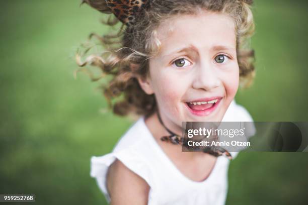 happy girl running and playing - cat ears headband stock pictures, royalty-free photos & images