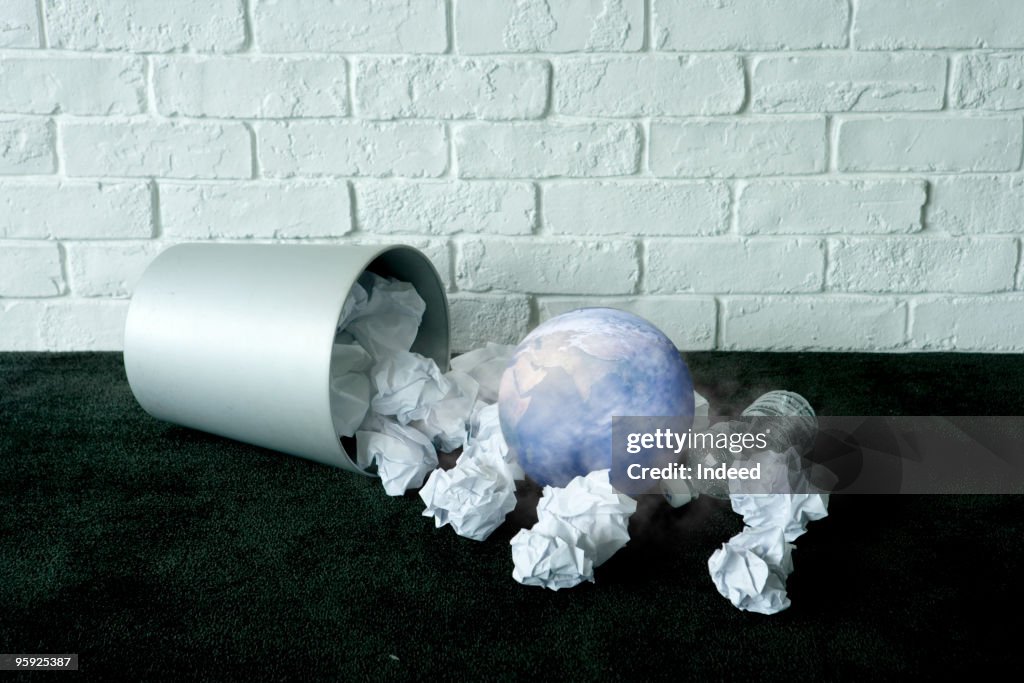 Earth in wastebasket