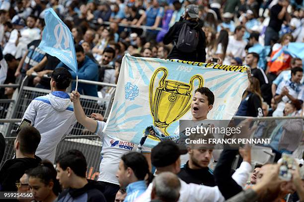 Olympique de Marseille fans react as they watch the Europa League final match Atletico Madrid against Marseille on May 16, 2018 at the Velodrome...