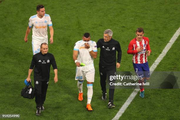 Dimitri Payet of Marseille looks dejected as he walks off the pitch after picking up an injury during the UEFA Europa League Final between Olympique...