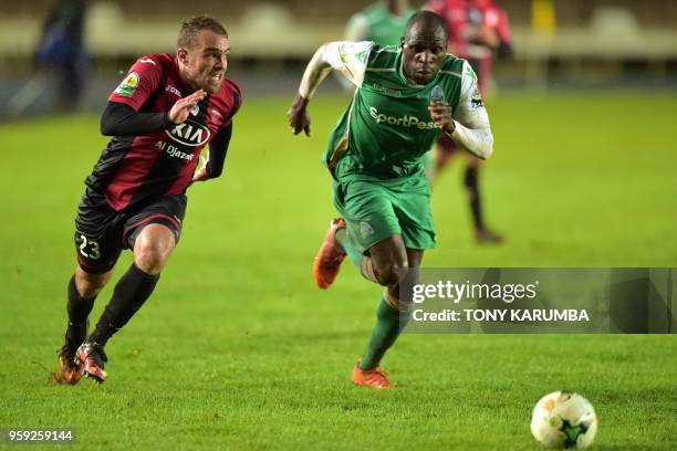 Algeria's USM Alger's Hemza Koudri tussles for the ball against Kenya's club side Gor Mahia's Joash Onyango on May 16, 2018 at the Kasarani stadium...