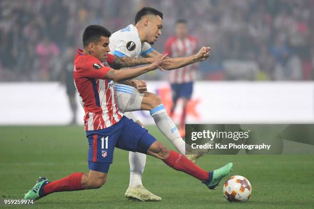 Angel Correa of Club Atletico de Madrid and Lucas Ocampos of Olympique de Marseille compete for the ball during the UEFA Europa League Final between...