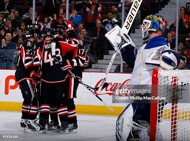 Alex Kovalev, Peter Regin, Milan Michalek and Filip Kuba of the Ottawa Senators celebrate a goal against Chris Mason of the St. Louis Blues in a game...