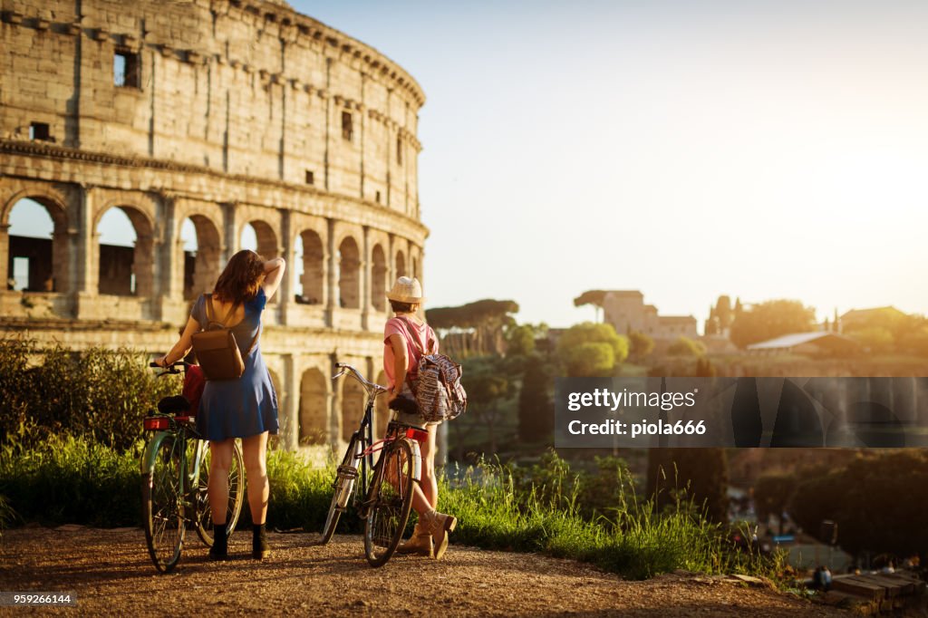 Tourist women in Rome: by the Coliseum