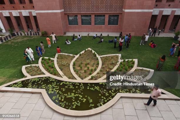 Supporters seen after party emerged as single largest party but fell short of majority mark in Karnataka assembly election outside the BJP head...