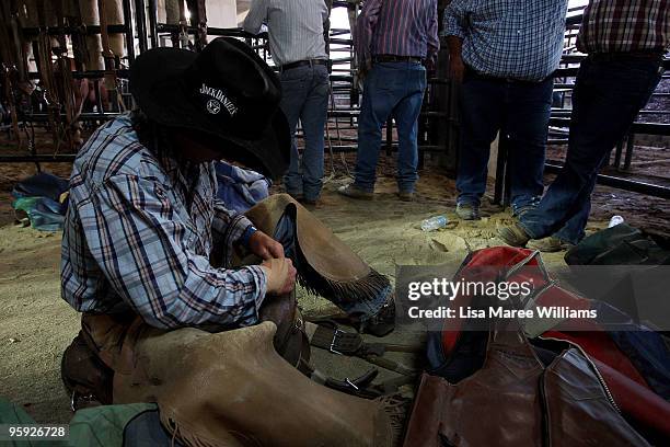 Bronc riders prepare in the back stalls at the ABCRA National Rodeo Finals on January 21, 2010 in Tamworth, Australia. The National Rodeo is held in...