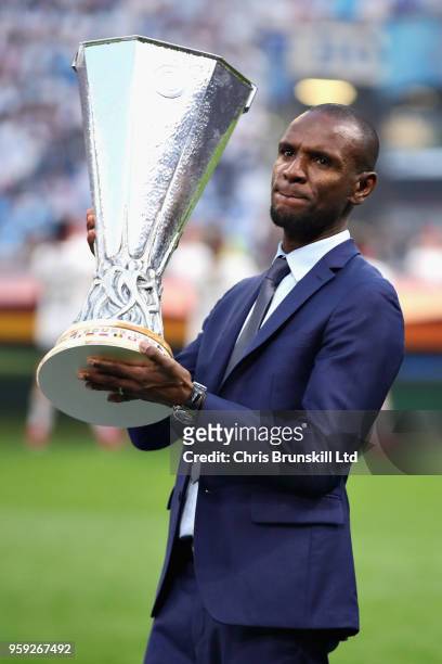 Former French football player Eric Abidal holds the UEFA Europa league trophy before the UEFA Europa League Final between Olympique de Marseille and...