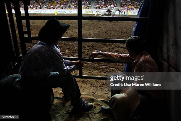 Cowboys sit close to the shoots to see riders compete at the ABCRA National Rodeo Finals on January 21, 2010 in Tamworth, Australia. The National...