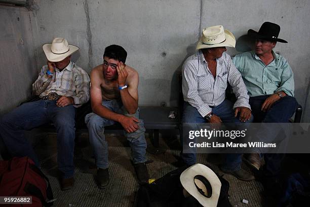 Cowboys sit in the back stalls at the ABCRA National Rodeo Finals on January 21, 2010 in Tamworth, Australia. The National Rodeo is held in...