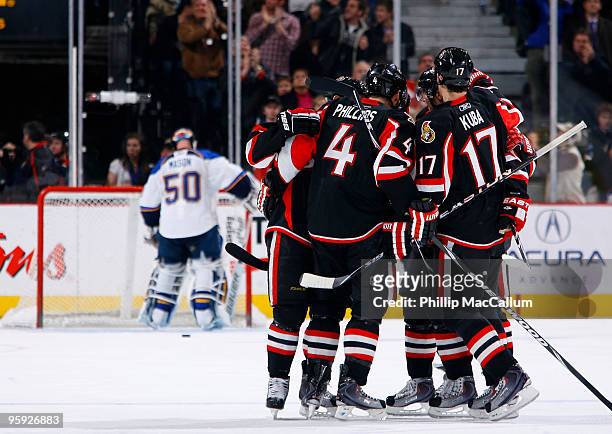 Chris Phillips of the the Ottawa Senators celebrates his game winning goal against the St. Louis Blues with his teammates in a game at Scotiabank...