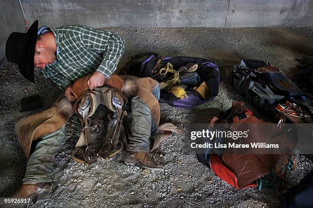 Bronc rider prepares his saddle in the back stalls at the ABCRA National Rodeo Finals on January 21, 2010 in Tamworth, Australia. The National Rodeo...