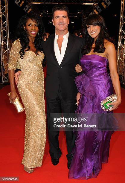 Sinitta, Simon Cowell and a guest arrive at the National Television Awards at the O2 Arena on January 20, 2010 in London, England.