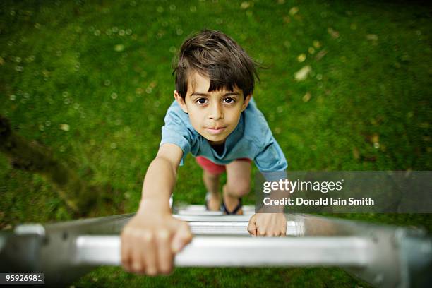 boy climbs ladder - kids climbing stock pictures, royalty-free photos & images