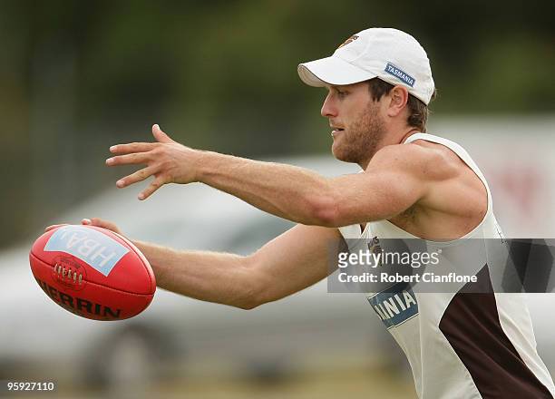 Campbell Brown of the Hawks holds the ball during a Hawthorn Hawks AFL training session at Toomuc Recreation Reserve on January 22, 2010 in...