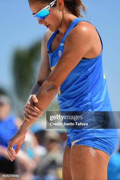 Sarah Sponcil of UCLA brushes sand off her arms during the Division I Women's Beach Volleyball Championship held at Gulf Beach Place on May 6, 2018...