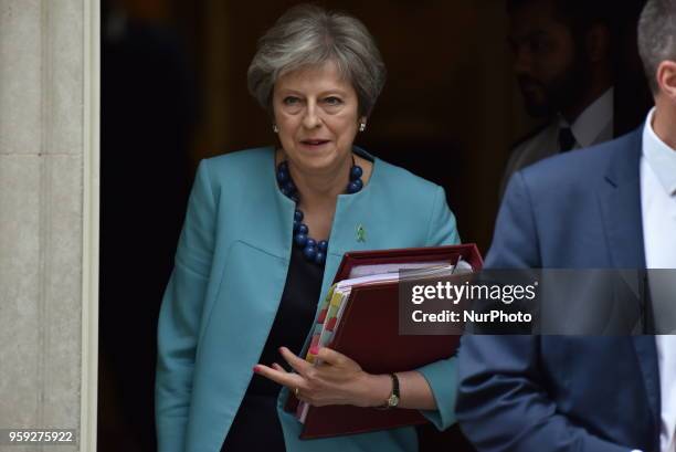 British Prime Minister Theresa May leaves 10 Downing Street as she heads to the Parliament to attend the weekly Prime Minister Questions session ,...