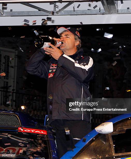Winner of the 2010 Dakar Rally in Chile, Carlos Sainz celebrates his victory with fans on January 21, 2010 in Madrid, Spain.