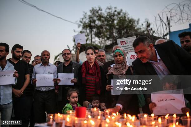 People light candles for the memories of Palestinians killed by Israeli occupation forces on protest held to mark 70th anniversary of Nakba, also...