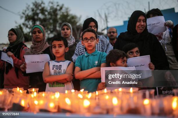 People light candles for the memories of Palestinians killed by Israeli occupation forces on protest held to mark 70th anniversary of Nakba, also...