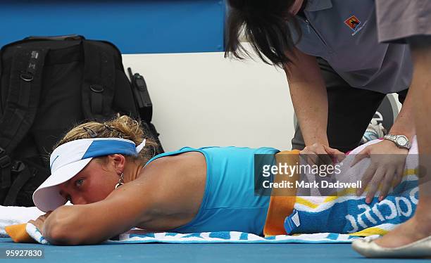 Yanina Wickmayer of Belgium recieves medical treatment between games in her third round match against Sara Errani of Italy during day five of the...