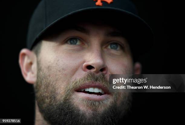 Hunter Strickland of the San Francisco Giants looks on from the dugout prior to the start of the game against the Cincinnati Reds at AT&T Park on May...