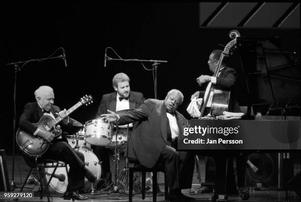 Canadian jazz pianist Oscar Peterson with guitarist Herb Ellis , drummer Jeff Hamilton and bassist Ray Brown performing at North Sea Jazz Festival,...