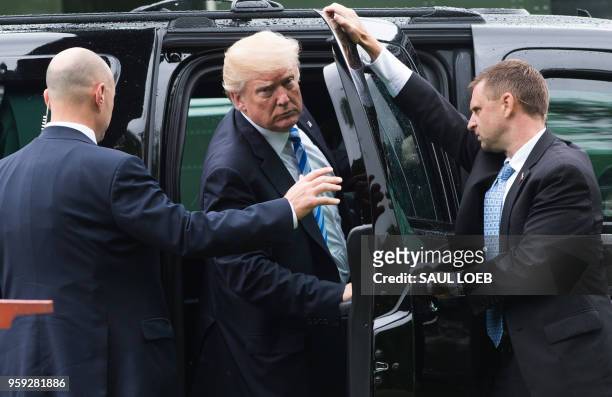 President Donald Trump gets into his SUV from Marine One after arriving at Walter Reed National Military Medical Center in Bethesda, Maryland, May 16...